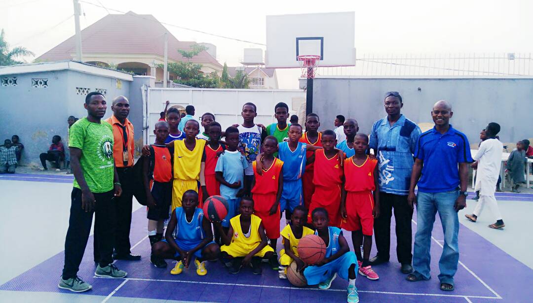 Youth basketball team on an outdoor court, Nigeria